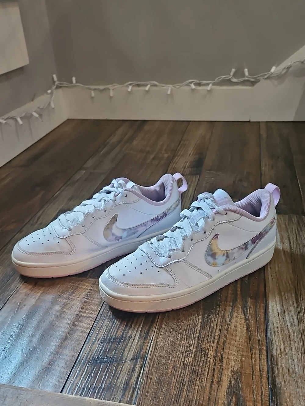 Nike White Low-Top Sneakers with Marbled Swoosh and Pink Details